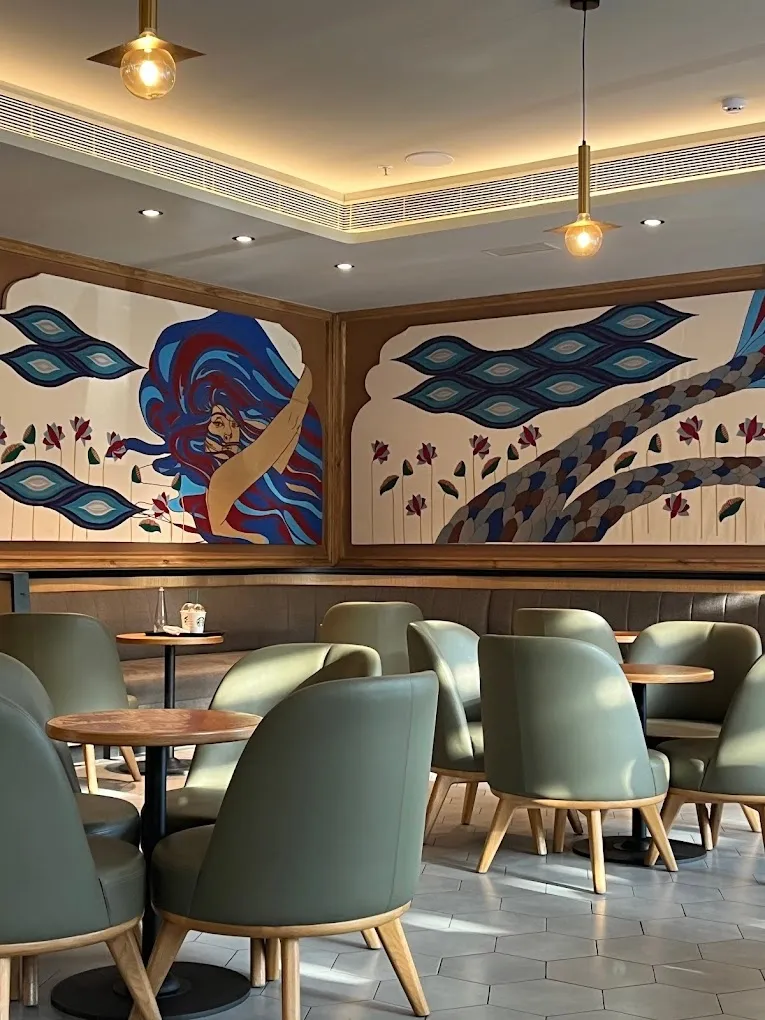 Detail of the embroidered Siren mural at Starbucks Polo Club, Udaipur